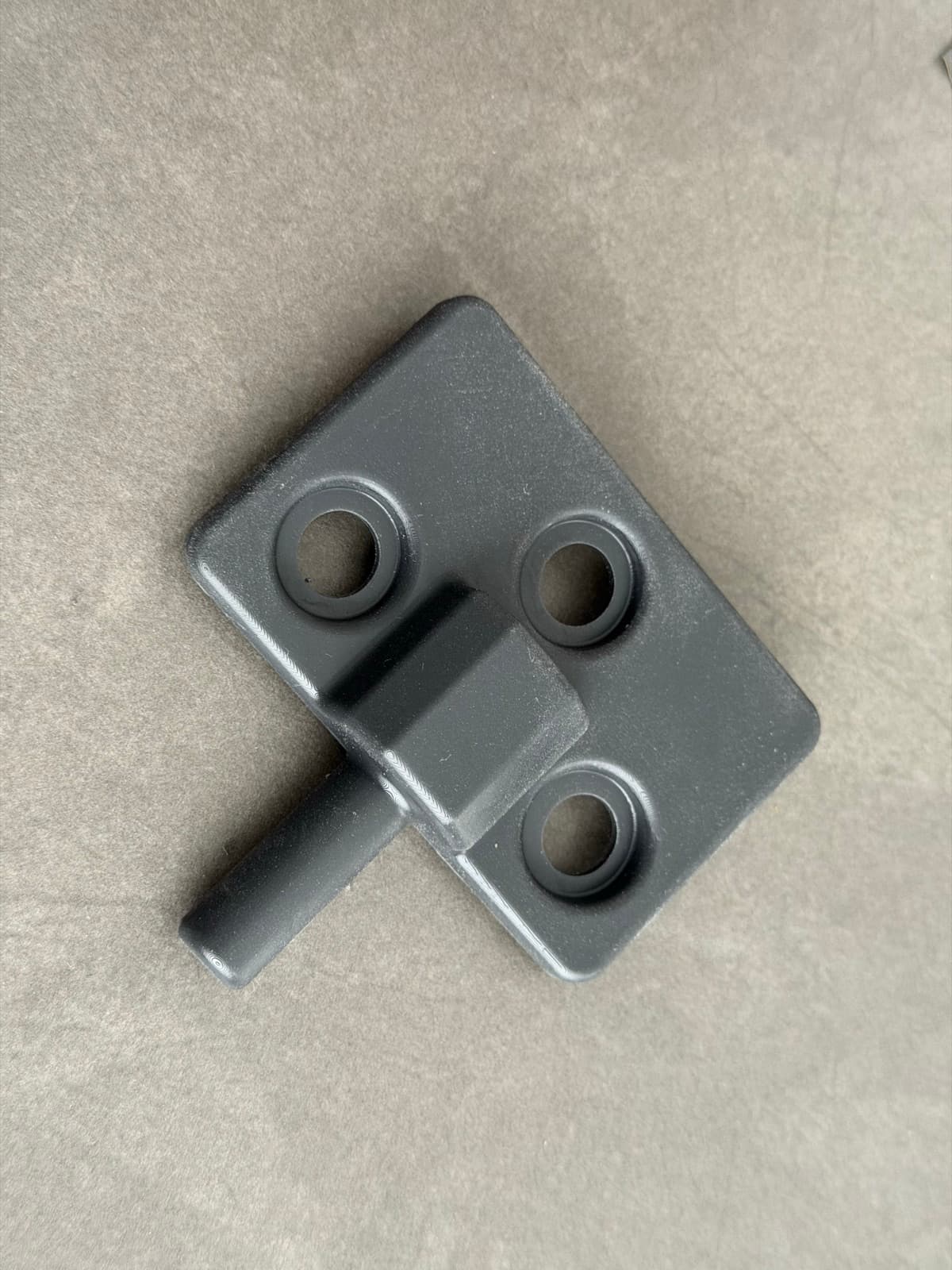 Top view of the finished replacement bracket with the rebuilt pivot pin